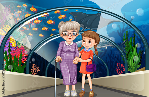 Grandmother and kid at aquarium