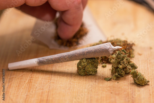 drug marijuana on a wooden background