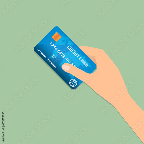 Hand with credit card for payment on green background.