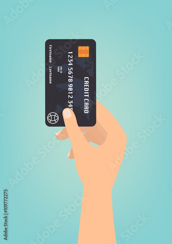 Hand with black credit card for payment on green background.