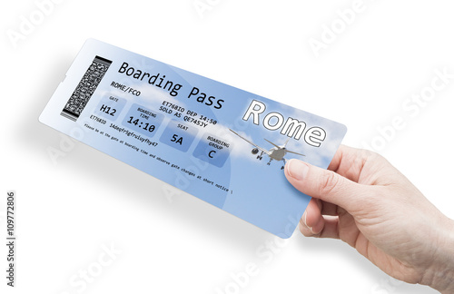 Photography Hand of a woman holding a airplane ticket to Rome