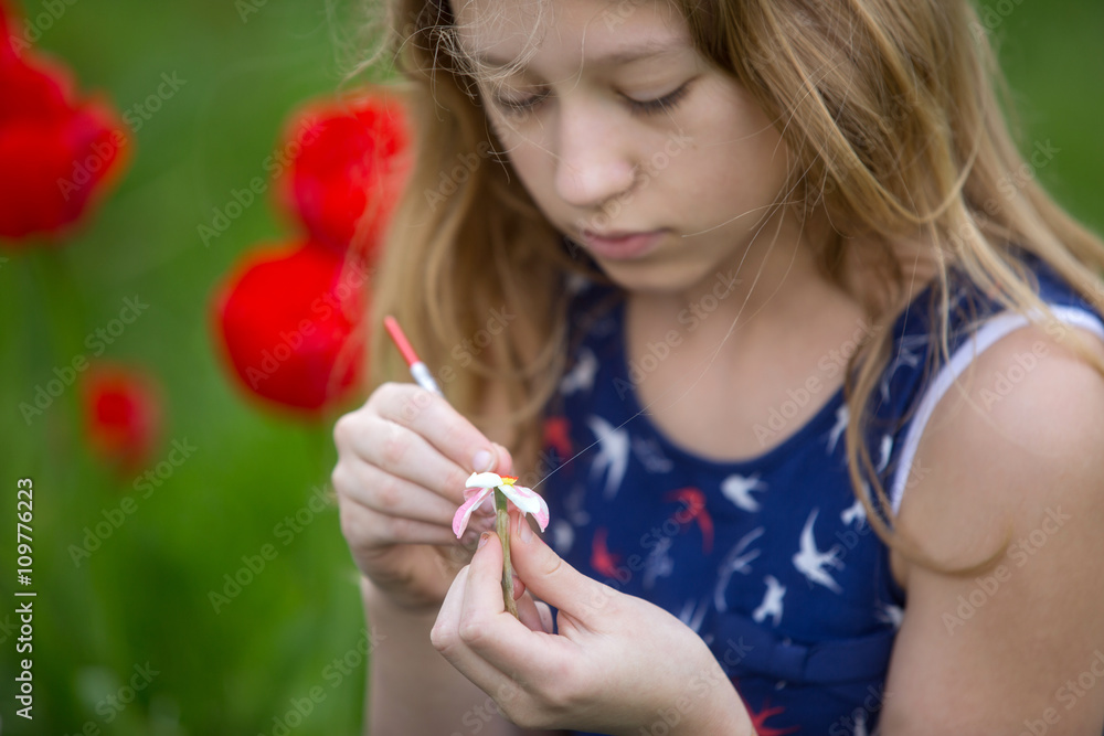 Young artist painting a landscape, Painting Flowers
Young artist painting a landscape, Painting Flowers