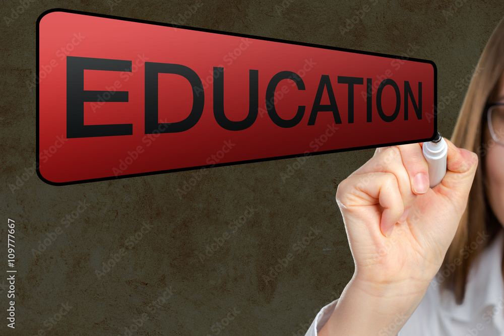 portrait of businesswoman pointing at Education portrait of businesswoman pointing at Education