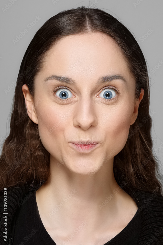 extremely surprised face with blue eyes open wide extremely surprised face with blue eyes open wide