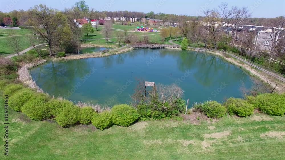 Flyover Duck Pond to Park Playground Equipment Aerial Footage 4k Flyover Duck Pond to Park Playground Equipment Aerial Footage 4k