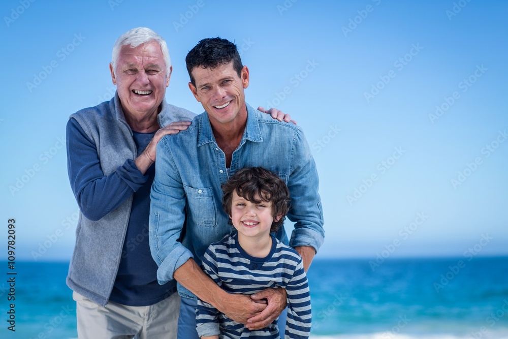 Male family members posing at the beach