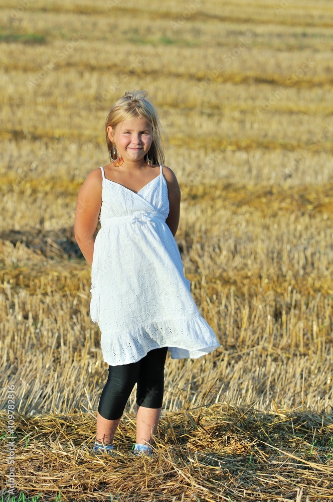 Beautiful girl enjoying the nature in the field Beautiful girl enjoying the nature in the field