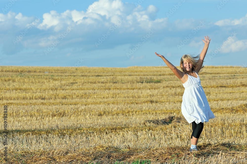 little girl outdoors in sunny summer day little girl outdoors in sunny summer day