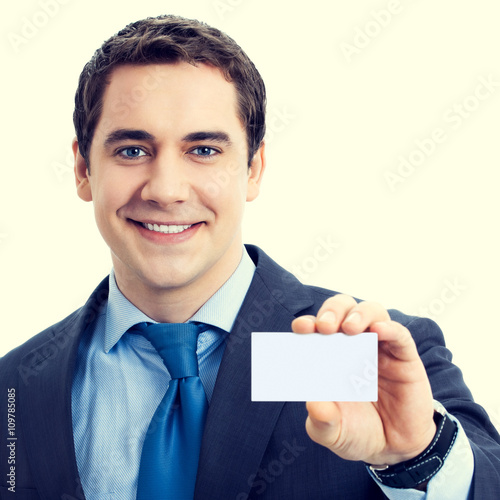 Happy smiling businessman showing blank businesscard