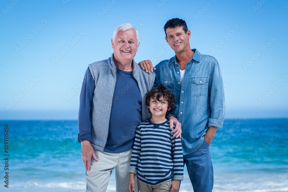 Male family members posing at the beach Male family members posing at the beach