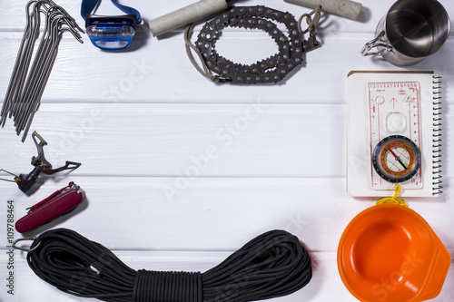 camping gear on rustic wood table