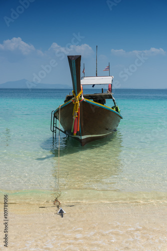 Thai boat longtail boat on the sea beach © sorapop