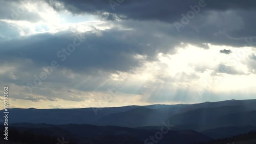 the sun's rays coming through the clouds accelerated
