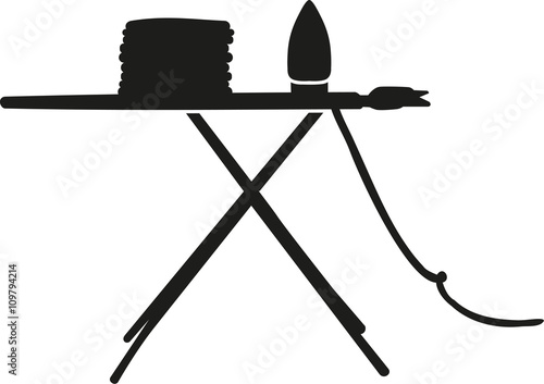 Ironing board with clothes and iron