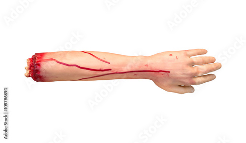 Bild auf Leinwand Fake severed human arm with terrible blood isolated on white background