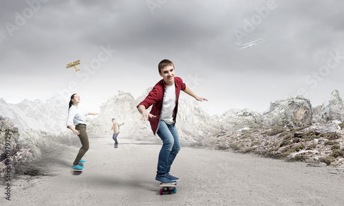Young people riding skateboard © Sergey Nivens