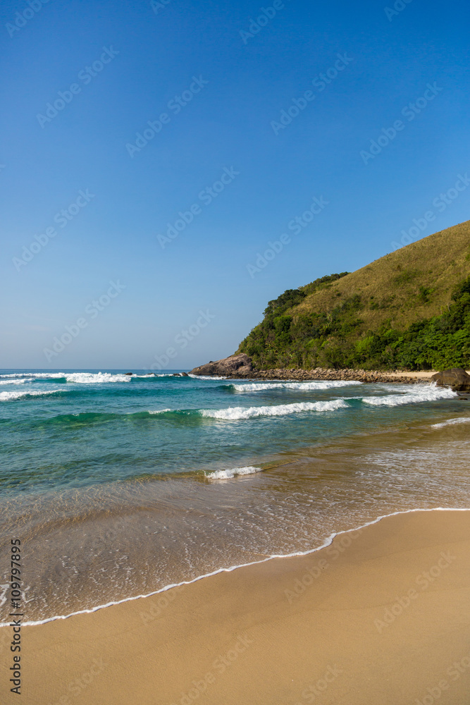 Beautiful blue water and sky in Beach Mole (praia Mole) in Florianopolis, Santa Catarina, Brazil.