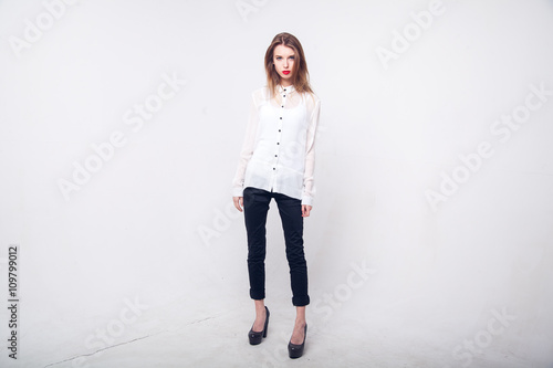 Contemporary Clothing Design. Modish Woman in White Blouse and Pants. Fashion