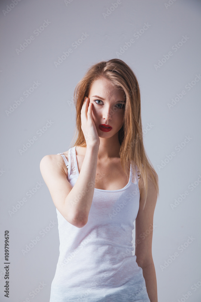 A young beautiful woman standing in underwear A young beautiful woman standing in underwear