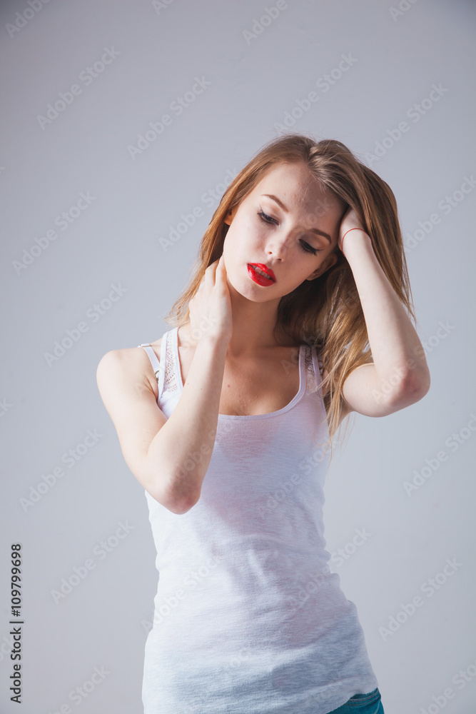 A young beautiful woman standing in underwear A young beautiful woman standing in underwear