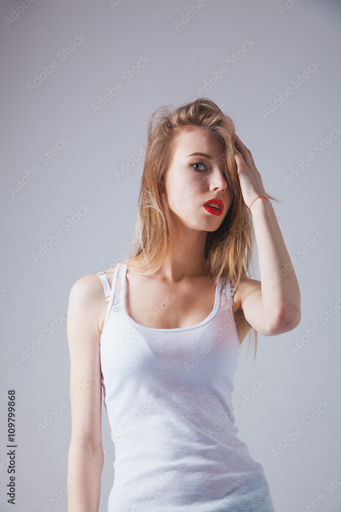 A young beautiful woman standing in underwear A young beautiful woman standing in underwear