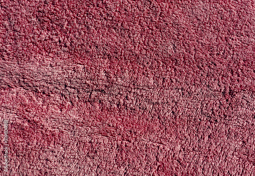 Dark red color bath towel texture.