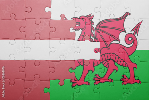 puzzle with the national flag of wales and latvia
