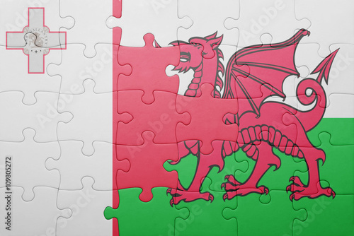 puzzle with the national flag of wales and  malta photo