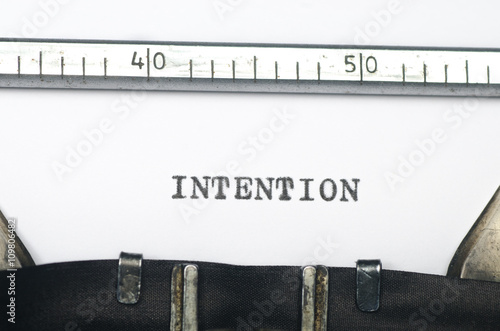 word intention typed on old typewriter