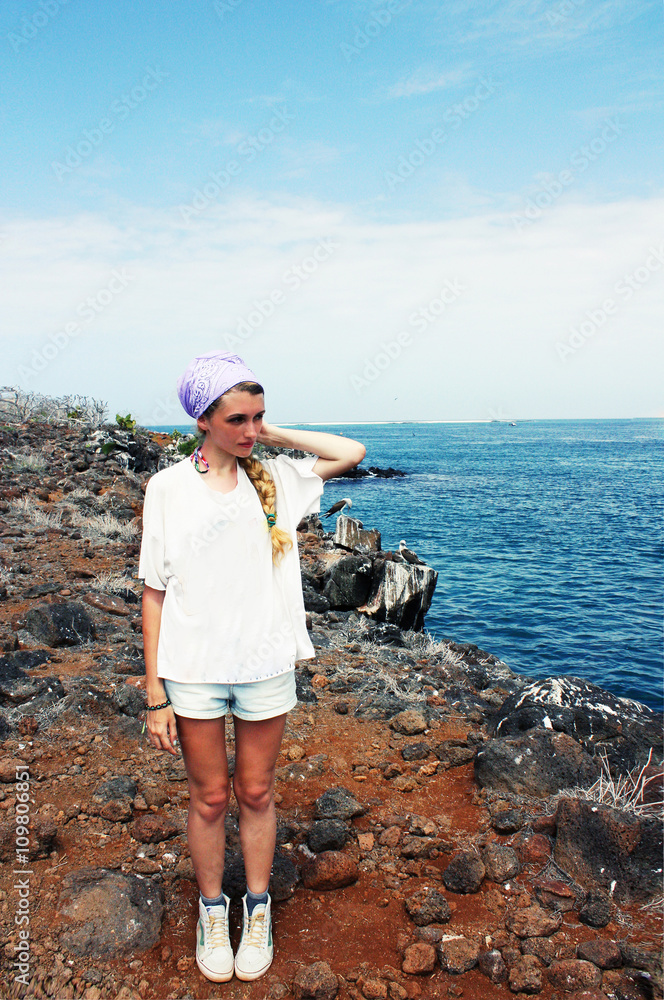 Girl on reef coast looking forward, North Seymur