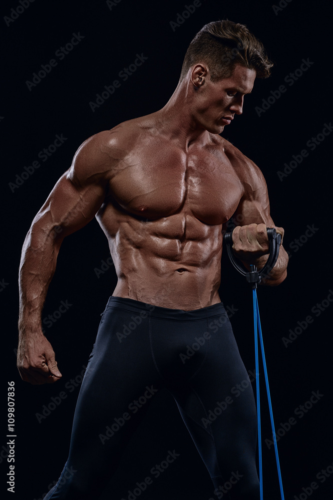 young charismatic bodybuilder exercise on muscles drying young charismatic bodybuilder exercise on muscles drying