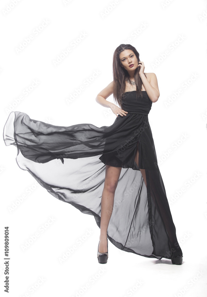 Naklejka premium Brunette woman in a black dress.