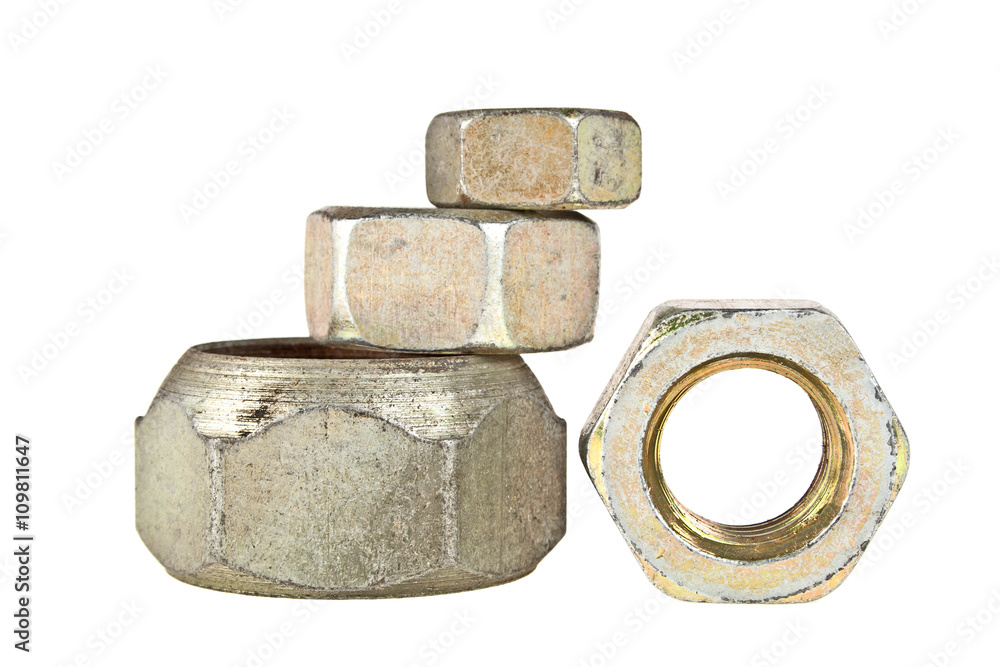 Metal nuts of different sizes isolated on white background Metal nuts of different sizes isolated on white background