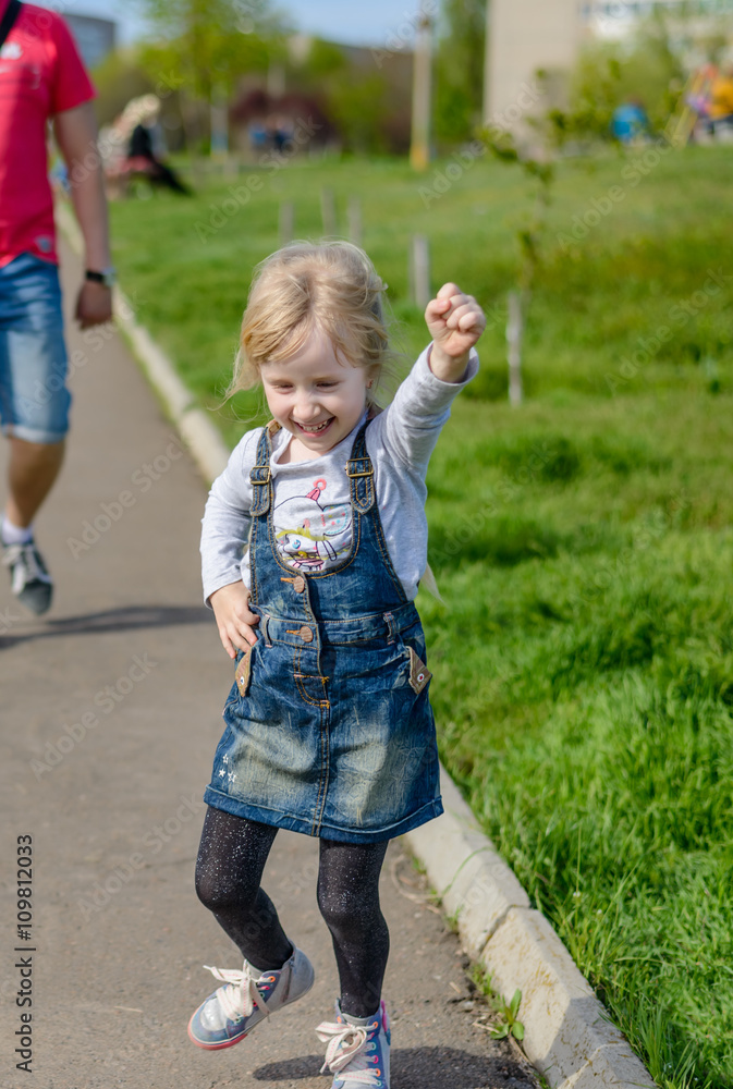 Fototapeta premium Little boy and girl having fun outdoors