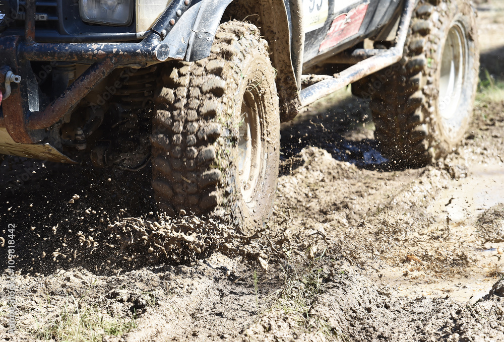 4x4 vehicle with tires full of mud to an off-road competition
4x4 vehicle with tires full of mud to an off-road competition