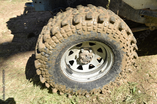 4x4 vehicle with tires full of mud to an off-road competition
