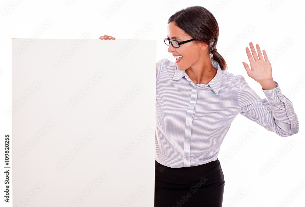 Surprised brunette businesswoman with a placard Surprised brunette businesswoman with a placard