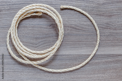rope coiled on a wooden table