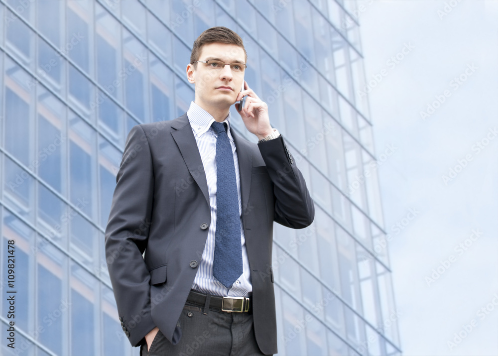 Young businessman in an urban setting Young businessman in an urban setting