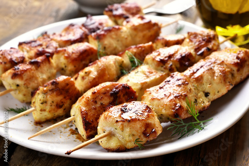 Grilled chicken on bamboo skewers © voltan