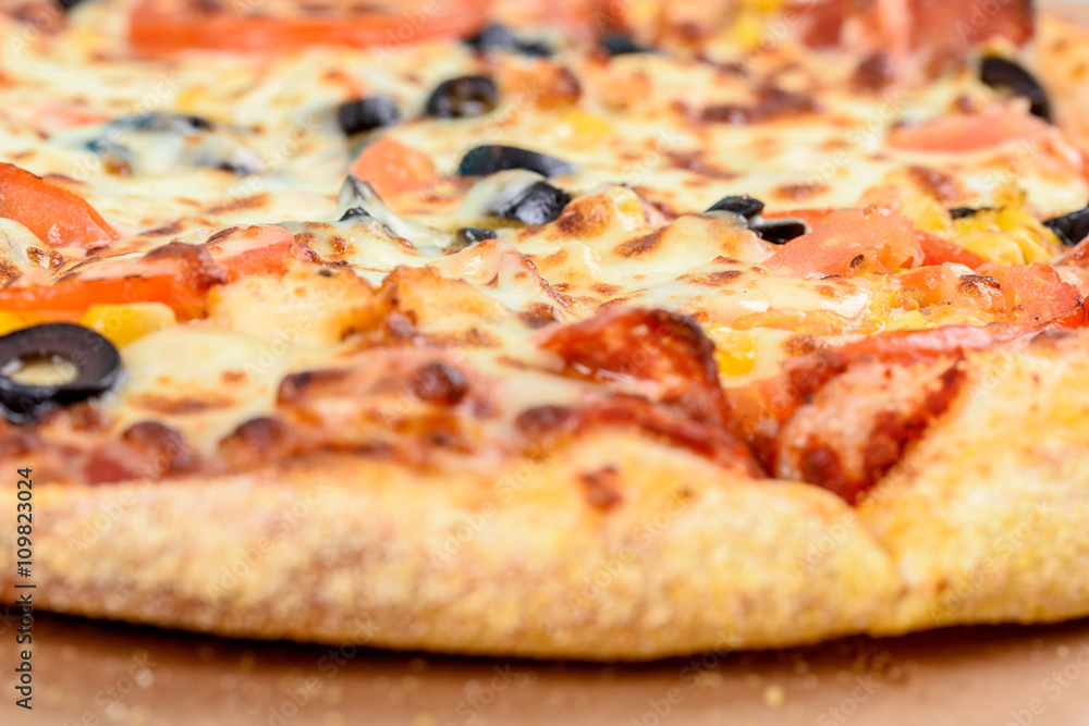 Italian Pizza With Mozzarella, Prosciutto, Tomatoes And Olives Italian Pizza With Mozzarella, Prosciutto, Tomatoes And Olives