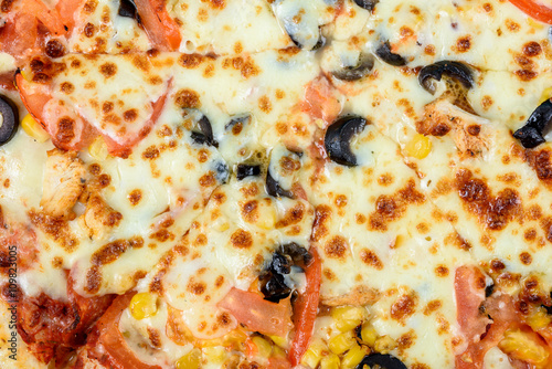 Italian Pizza With Mozzarella, Prosciutto, Tomatoes And Olives