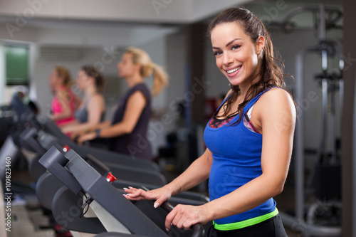Beautiful brunette on a treadmill