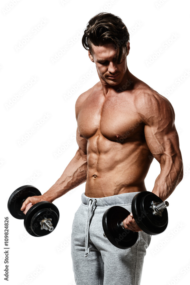 Muscular bodybuilder guy doing exercises with dumbbells Muscular bodybuilder guy doing exercises with dumbbells
