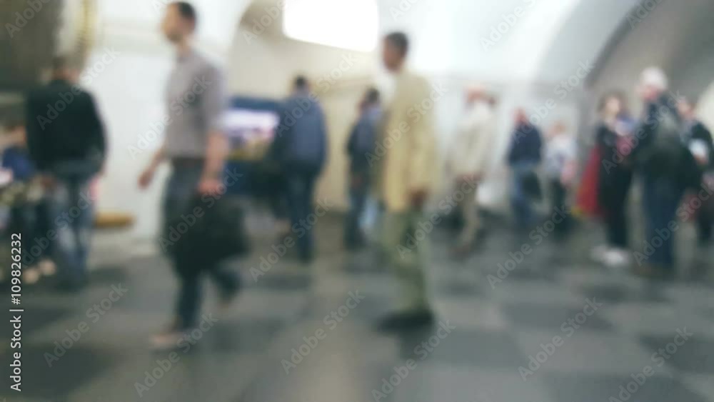 Crowd of people moving at the metro station, blurred background Crowd of people moving at the metro station, blurred background
