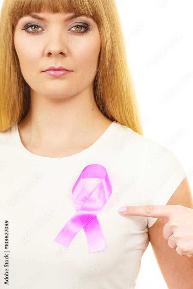 Woman wih pink cancer ribbon on chest Woman wih pink cancer ribbon on chest