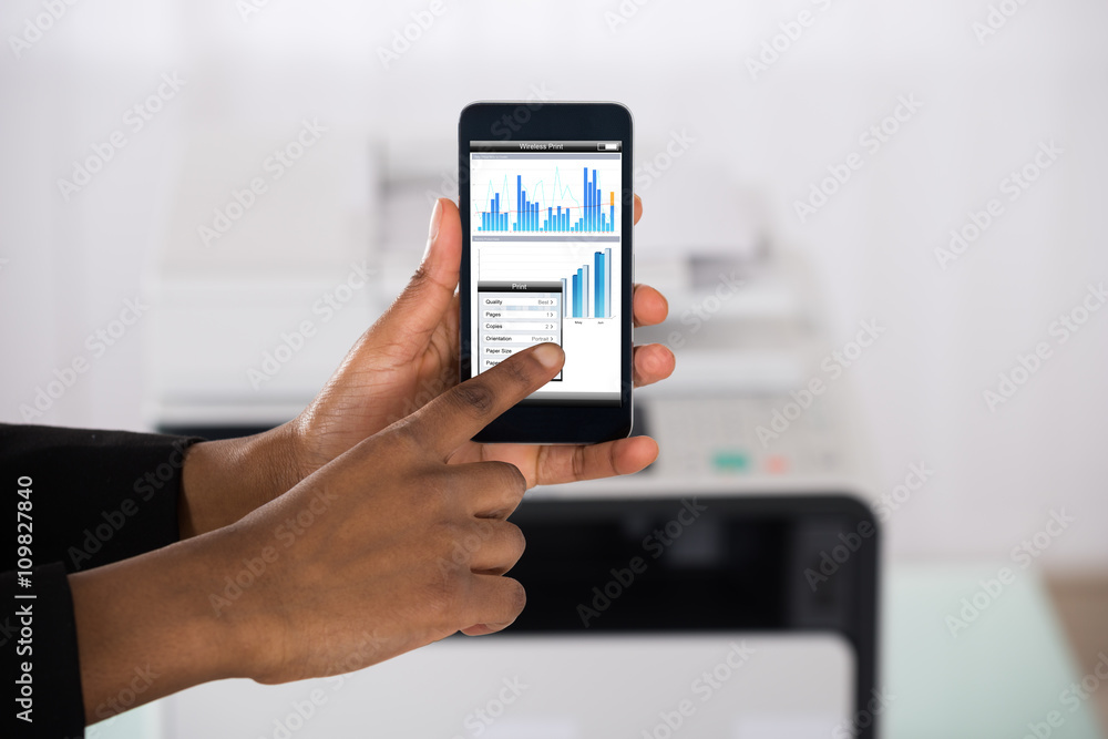 Businesswoman Using Smartphone For Printing Graph Paper