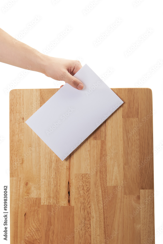 hand hold paper near wood box hand hold paper near wood box