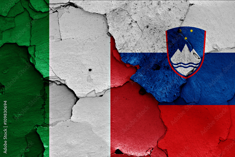 flags of Italy and Slovenia painted on cracked wall