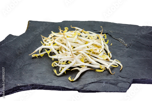 Bean sprouts with stone on white background